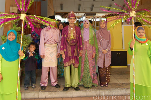 Its a mix and match of purple and green traditional songket suit